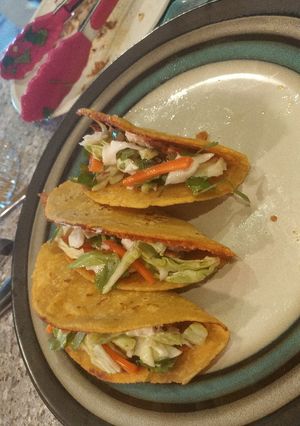A picture of Whizzle grilled fish tacos with thug kitchen slaw.