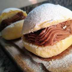Una foto de Berlinesas horneadas con Crema pastelera Nutella💣
