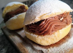 Una foto de Berlinesas horneadas con Crema pastelera Nutella💣