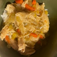 A picture of Chicken gravy over rice.