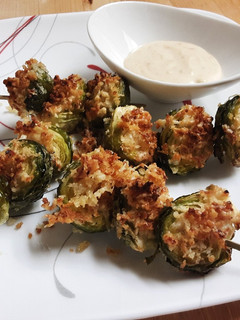A picture of Crispy Parm Brussels Sprouts with Roasted Garlic Aioli.