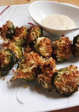 A picture of Crispy Parm Brussels Sprouts with Roasted Garlic Aioli.