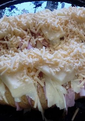 Una foto de Papas al horno rellenas con jamón y queso