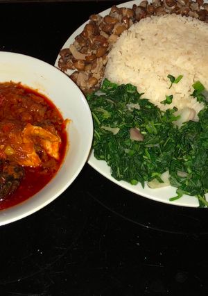 A picture of Veggie rice and beans with fish stew.