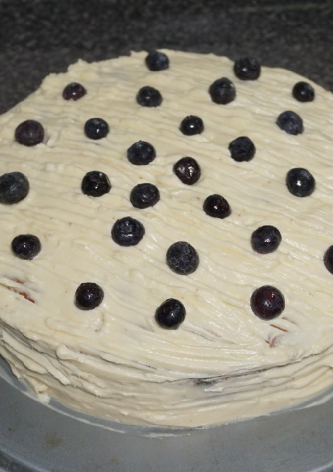 Una foto de Queque de arándanos con glaseado de queso crema