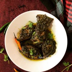 A picture of Ilish Macher Kalo Jhaal (Hilsa Fish cooked with Nigella Seeds paste).