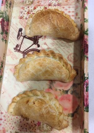 Una foto de Empanadas de bondiola a la cerveza y cebollas confitadas