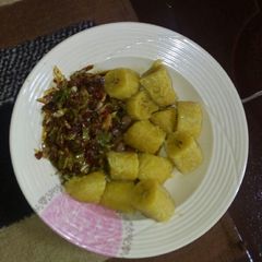 A picture of Boiled plantain wit veg sauce.
