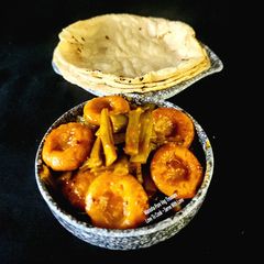 Jowar Roti With Gavar Dhokli Sabzi - Jowar Roti With Clusterbeans Flat Dumplings Curry A picture of Jowar Roti With Gavar Dhokli Sabzi - Jowar Roti With Clusterbeans Flat Dumplings Curry.