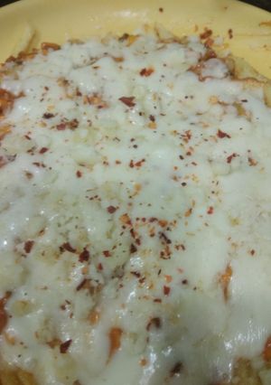 A picture of French fries pizza.