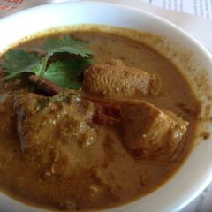 A picture of Varathuarache Chicken curry/ Roasted Coconut Chicken Curry.