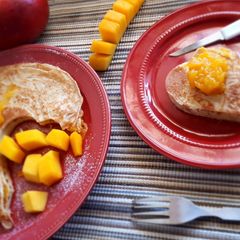A picture of Crepes served with mango jam.