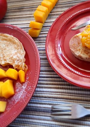 A picture of Crepes served with mango jam.
