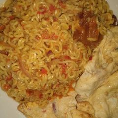 A picture of Indomie with vegies pomo and fried egg.