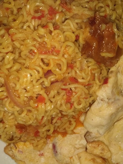 A picture of Indomie with vegies pomo and fried egg.