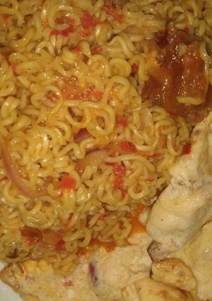 A picture of Indomie with vegies pomo and fried egg.