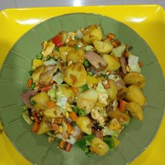 A picture of Potatoes in veggie sauce.