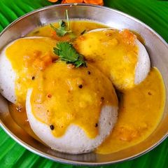 A picture of Spice sambhar with soft idli.