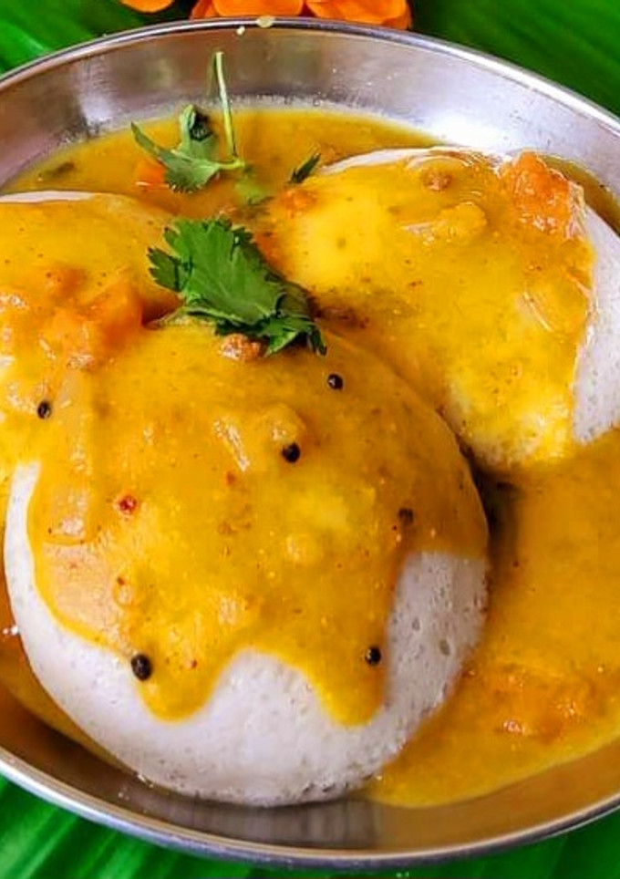 A picture of Spice sambhar with soft idli.