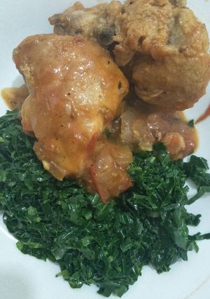 A picture of Chicken stew with greens.