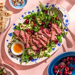 A picture of Picota cherries and grilled steak salad.