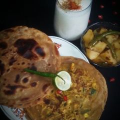 A picture of Jeera aloo,masala chaas with masala paratha.
