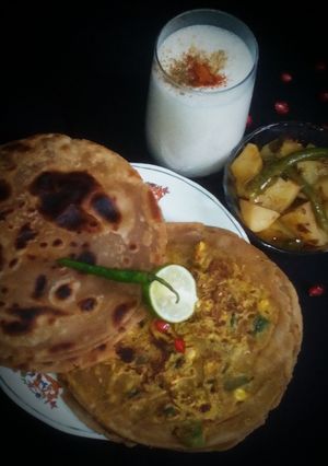 A picture of Jeera aloo,masala chaas with masala paratha.