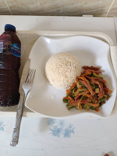 A picture of Coconut rice & vegetable sauce.