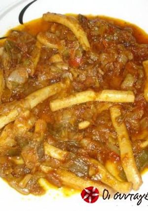 A picture of Braised calamari in tomato sauce.
