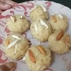 A picture of Milk and raw coconut ladoo.