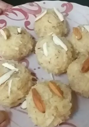 A picture of Milk and raw coconut ladoo.