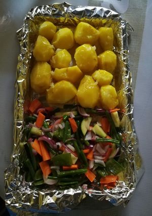 A picture of Baked potatoes and vegetables.