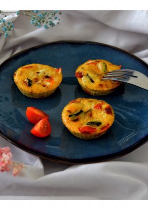 Une photo de Mini flans courgettes et tomates
