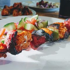 A picture of Chicken Skewers With Chunky Salad.