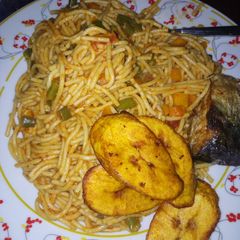 A picture of Jollof Spaghetti and plaintain.