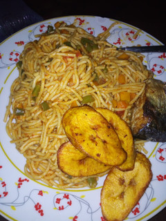 A picture of Jollof Spaghetti and plaintain.