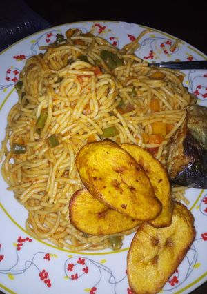 A picture of Jollof Spaghetti and plaintain.