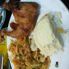 A picture of Fried Chicken, Veges with Ugali.