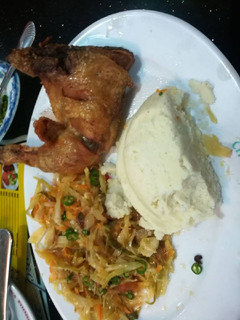 A picture of Fried Chicken, Veges with Ugali.