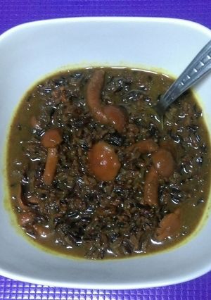 Foto principal de Arroz salvaje caldoso con avellana, uvas pasas y setas nameko