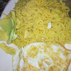 A picture of Noddles, pan egg and avocado.