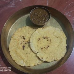 A picture of Makai  no rotlo Maize corn roti   with masoor.