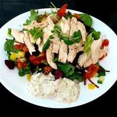 A picture of My Steamed Chicken on a bed of Salad.