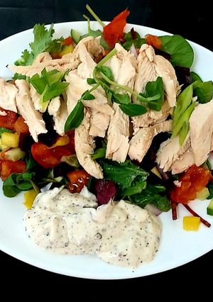 A picture of My Steamed Chicken on a bed of Salad.