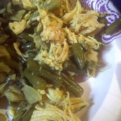 A picture of Shredded saffron chicken and green beans.