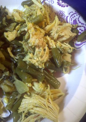 A picture of Shredded saffron chicken and green beans.
