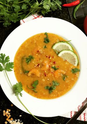 A picture of Lentil Oats Porridge with Tomatoes and Prawns.