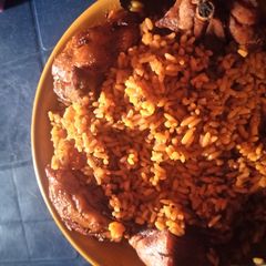 A picture of Jellof rice and chicken.