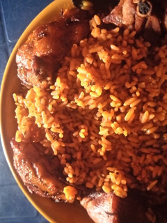 A picture of Jellof rice and chicken.