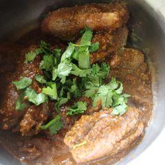 A picture of Andhra Style Gutti Vankaya Pulusu Koora /Stuffed Brinjal Gravy Curry.